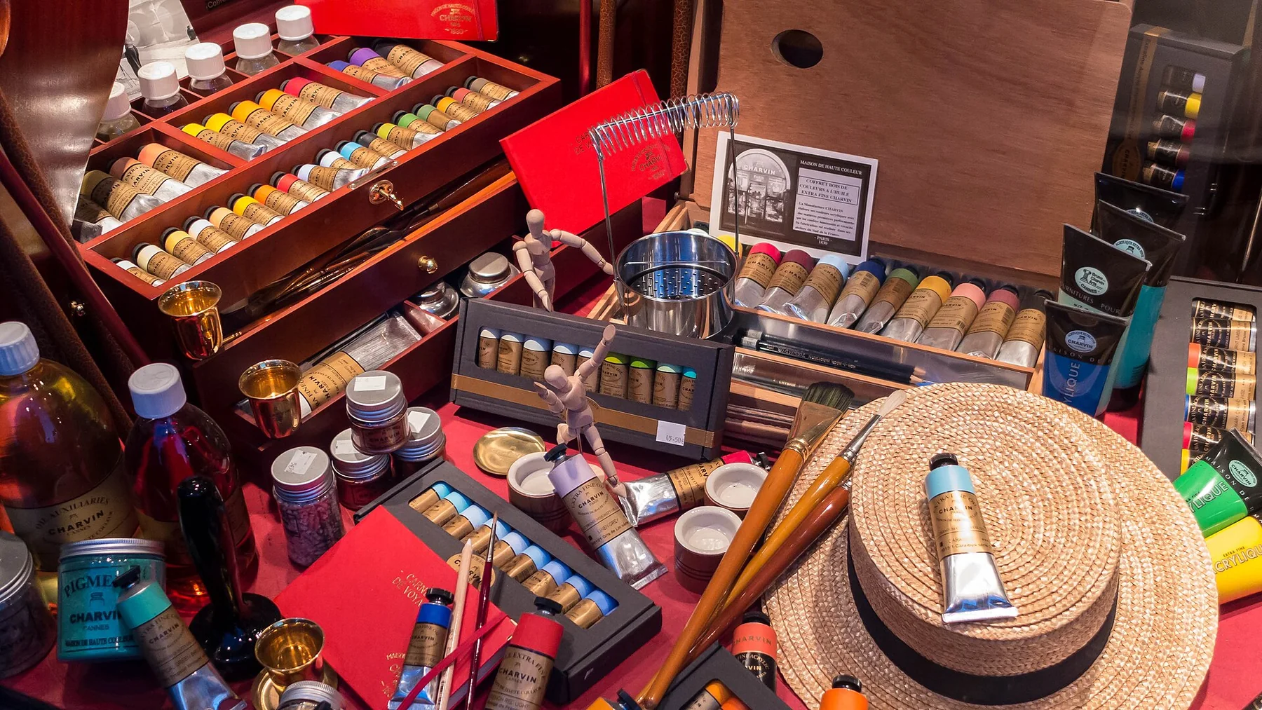 Paints and brushes arranged in an art-supply display