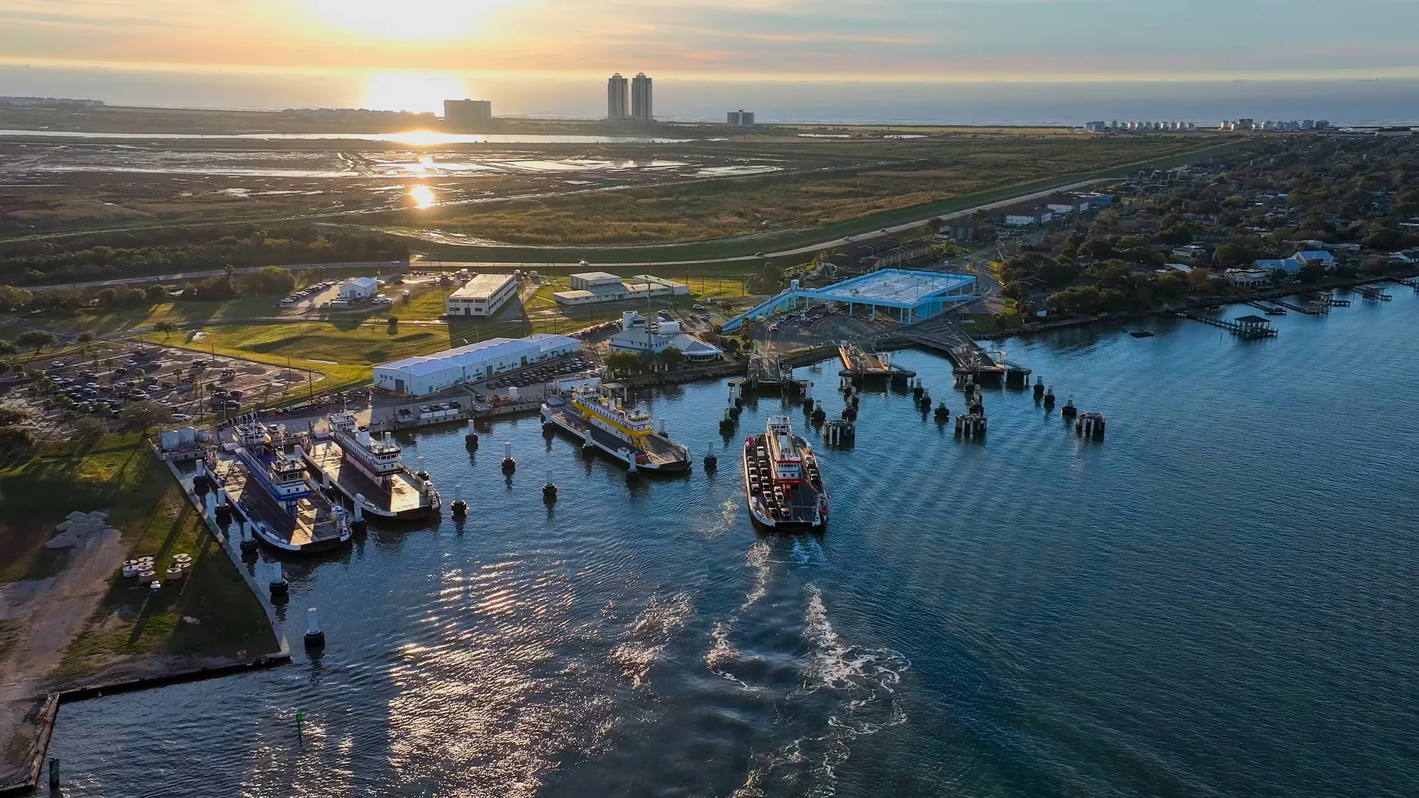 Ferries and Galveston's working waterfront at sunset