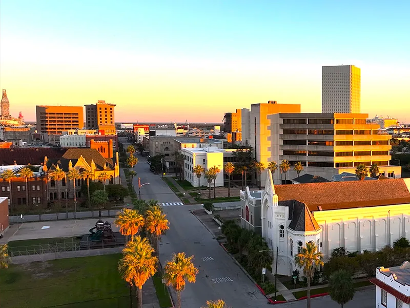An aerial view across downtown Galveston toward the port.