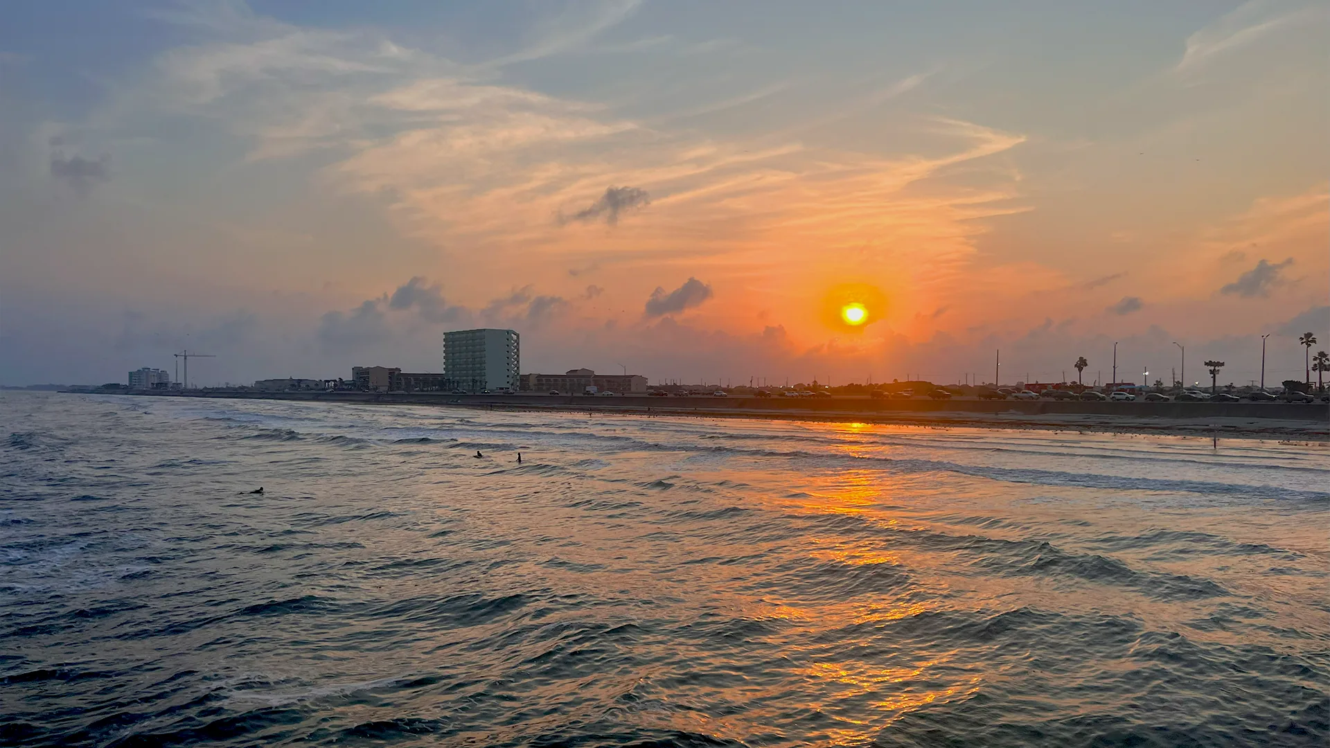 Sunset over the Gulf and Galveston's Seawall.